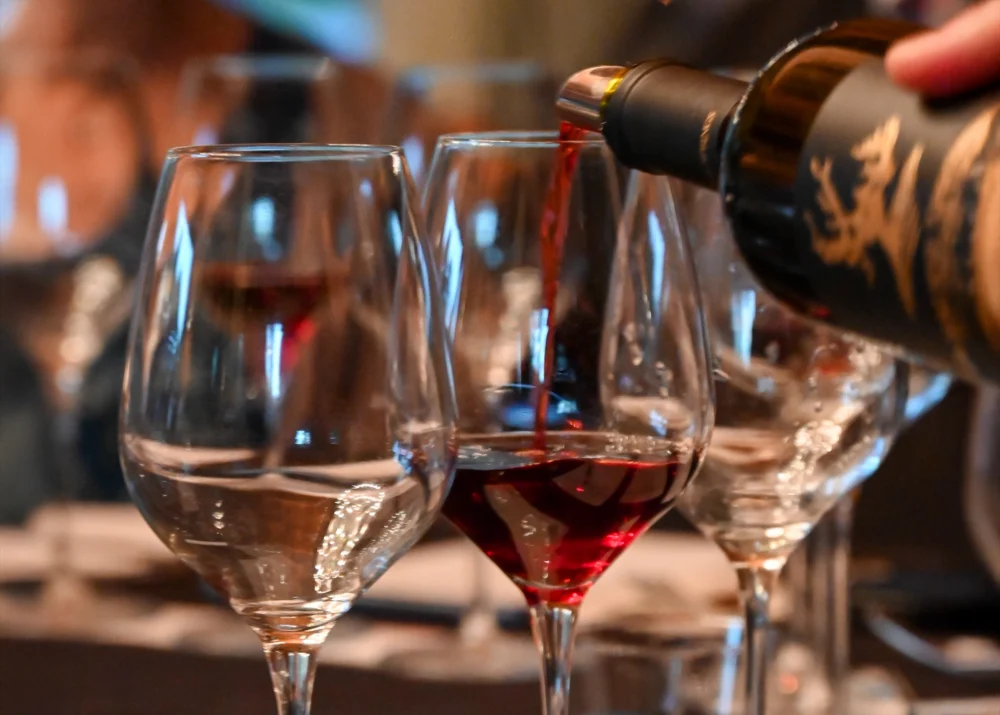Pouring red wine at Paradise Springs