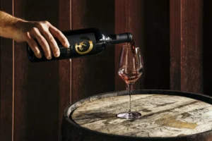 Wine being poured into a glass at Paradise Springs Winery